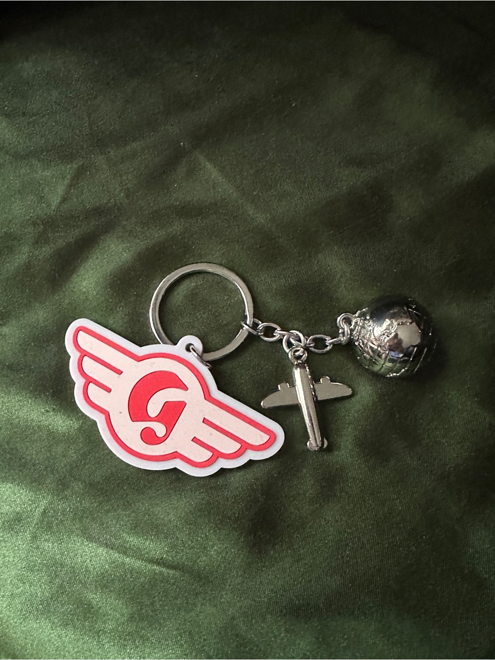 Glossier D.C plane keychain